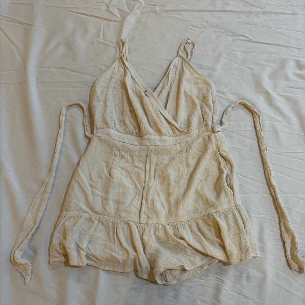 beachy cream romper, with a tie waist to adjust to your liking!